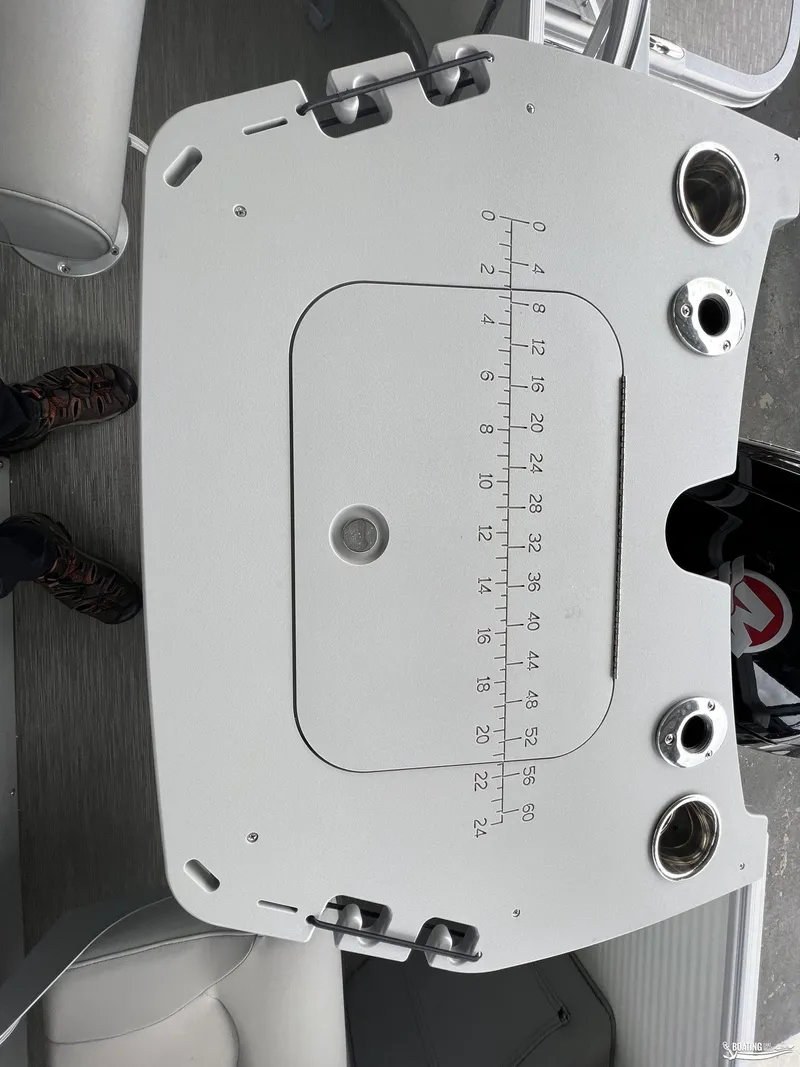 Slide: The Image of 2023 Bennington 21SF boat console with built-in measuring scale and cup holders. - 8