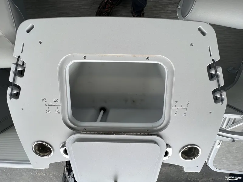 Slide: The Image of Bennington 21SF 2023 boat livewell with measurement markings and cup holders. - 9