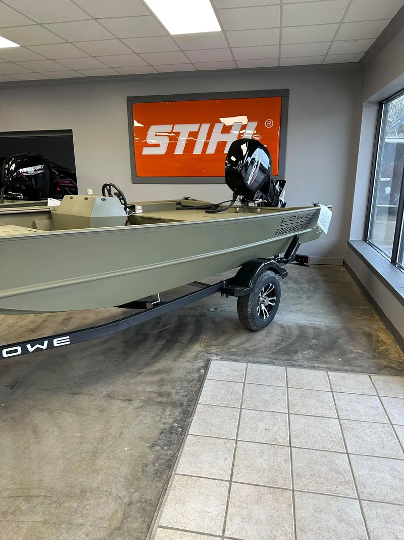 Slide: The Image of 2023 Lowe RX16SC boat on display in showroom with Stihl sign. - 4