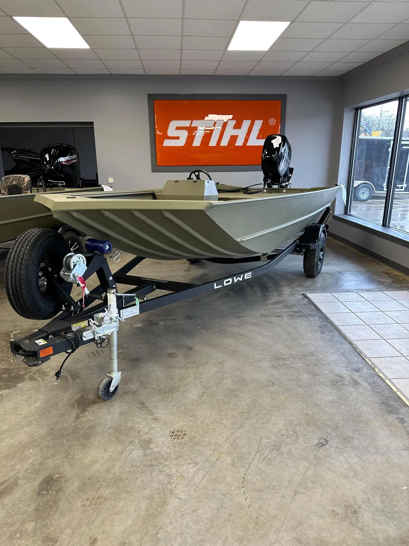 Slide: The Image of 2023 Lowe RX16SC boat on trailer in showroom with Stihl sign. - 5