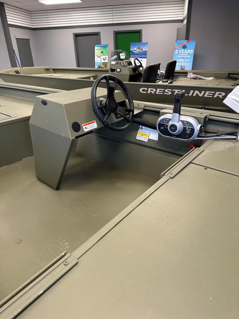 Slide: The Image of 2023 Lowe RX16SC boat interior with steering wheel and control panel. - 7