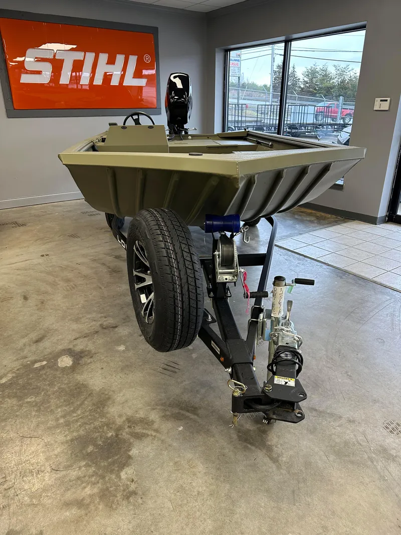 Slide: The Image of 2023 Lowe RX16SC boat on trailer in showroom. - 8