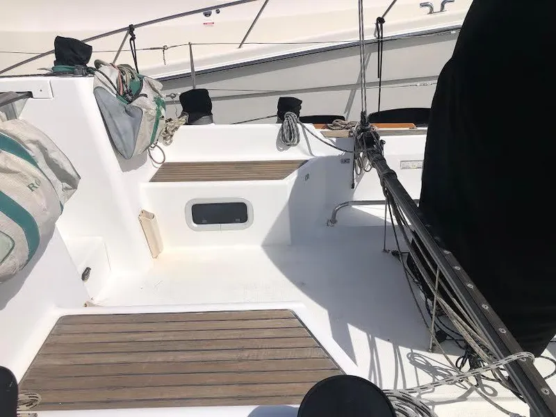 Slide: The Image of 2003 Beneteau First sailboat cockpit with wooden flooring and rigging. - 10