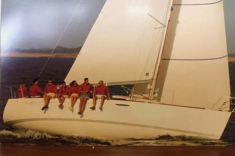 Slide: The Image of 2003 Beneteau First sailboat with crew sailing on open water. - 7