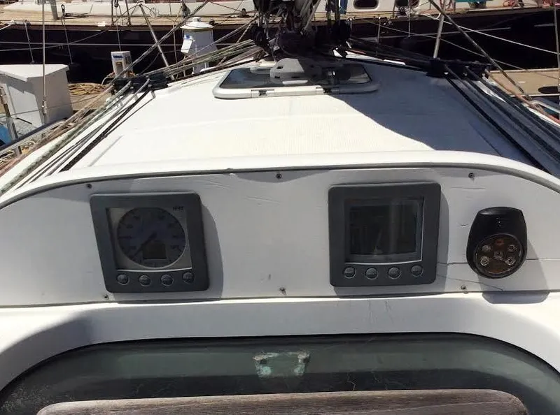 Slide: The Image of 2003 Beneteau First yacht cockpit with navigation instruments and controls. - 8