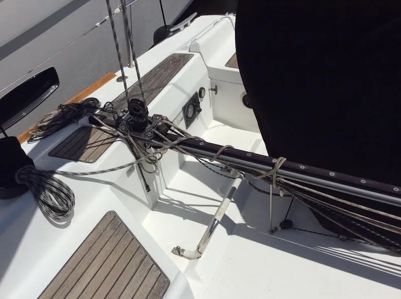 Slide: The Image of 2003 Beneteau First sailboat deck with rigging and wooden accents. - 9