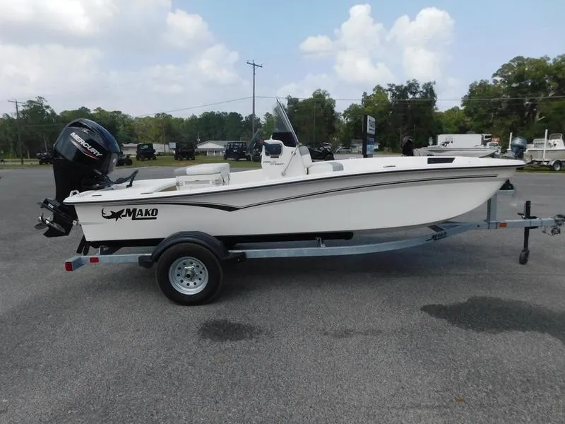 Slide: The Image of 2023 Mako Pro Skiff 15 CC on trailer with outboard motor. - 1