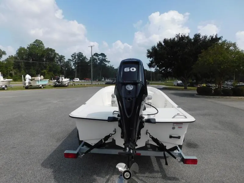 Slide: The Image of 2023 Mako Pro Skiff 15 CC with 60 HP engine on trailer. - 3