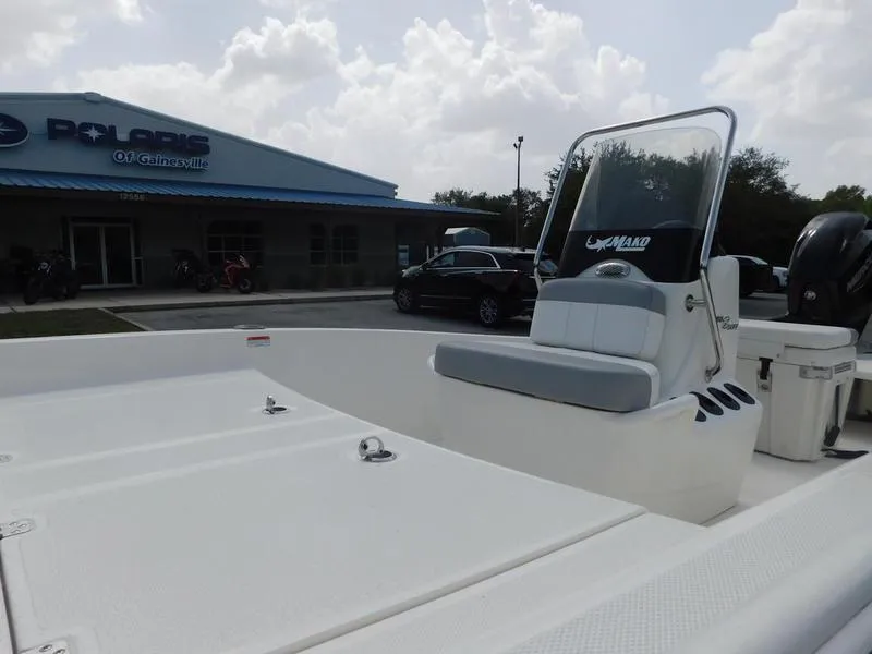Slide: The Image of 2023 Mako Pro Skiff 15 CC boat at dealership, front seating and console view. - 6