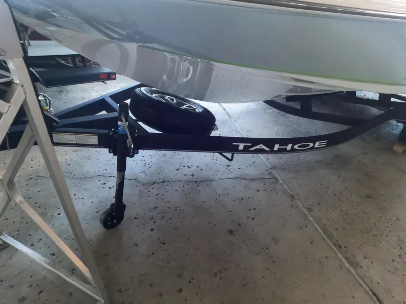 Slide: The Image of 2023 Tahoe 2150 CC boat trailer in a garage setting. - 4