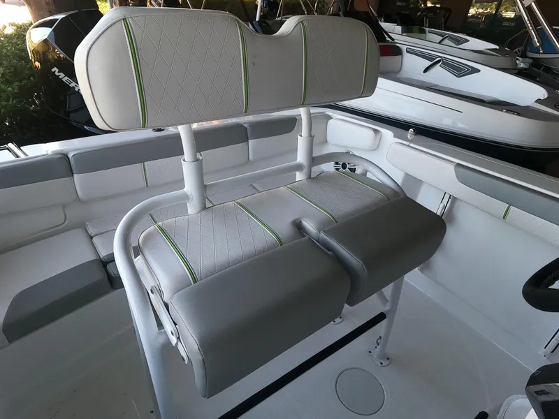 Slide: The Image of 2023 Tahoe 2150 CC boat interior with cushioned seating and modern design. - 6