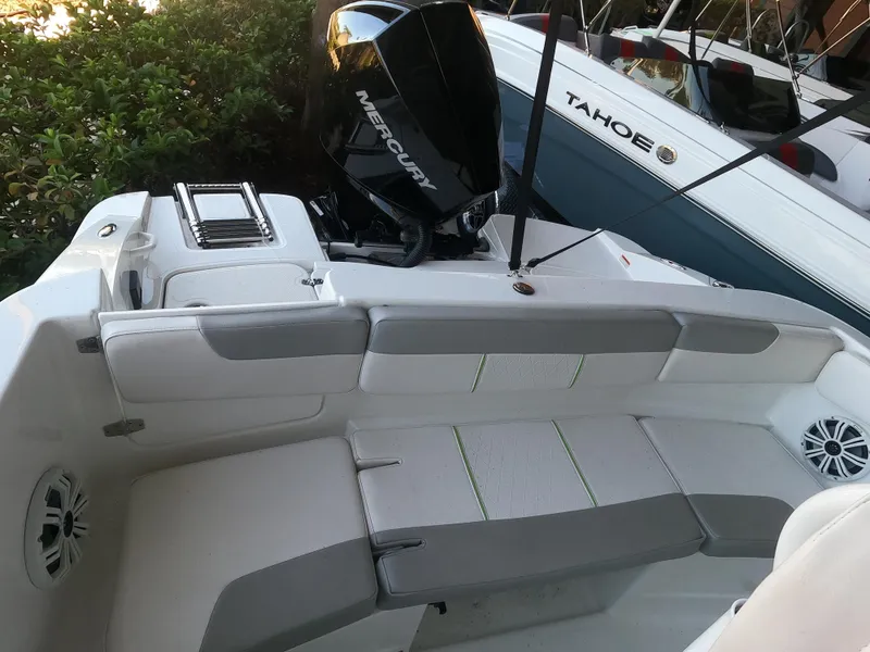 Slide: The Image of 2023 Tahoe 2150 CC boat with Mercury engine, featuring spacious seating and modern design. - 8