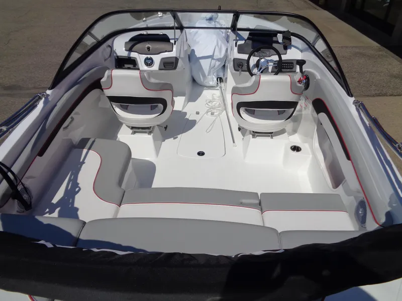 Slide: The Image of 2023 Tahoe 210 Si boat interior with seating and dashboard. - 6