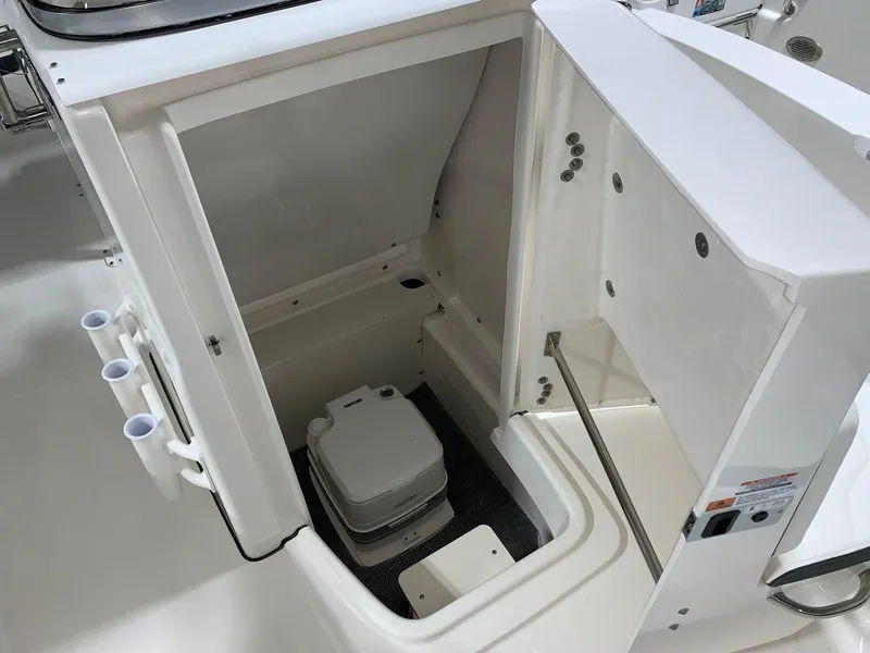 Slide: The Image of 2024 Robalo R180 Center Console boat with open storage compartment. - 4