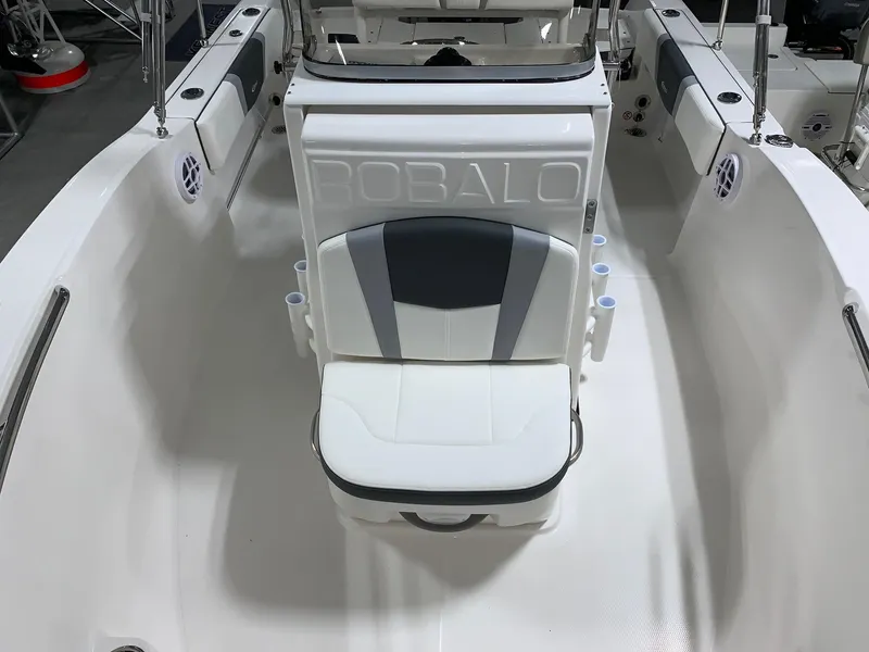 Slide: The Image of 2024 Robalo R180 Center Console boat interior with cushioned seating. - 8