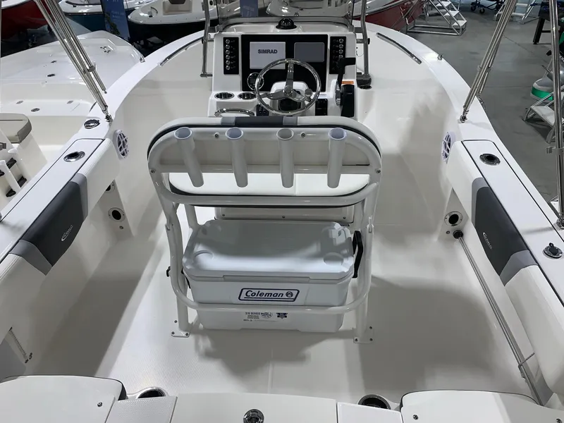 Slide: The Image of 2024 Robalo R180 Center Console boat interior with steering console and seating. - 3