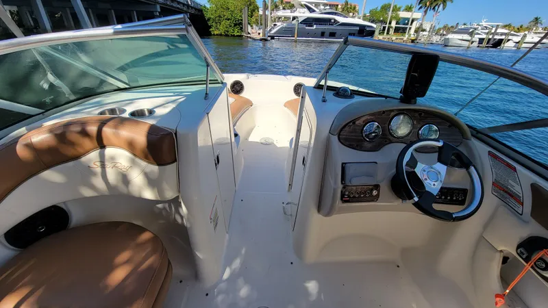 Slide: The Image of 2007 Sea Ray SunDeck 200 boat interior with steering wheel and seating. - 12