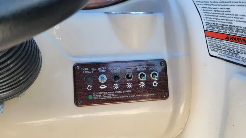 Slide: The Image of Control panel of 2007 Sea Ray SunDeck 200 boat with labeled switches. - 18