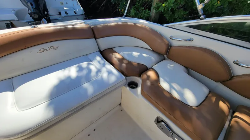 Slide: The Image of 2007 Sea Ray SunDeck 200 boat interior with tan and white seating. - 20