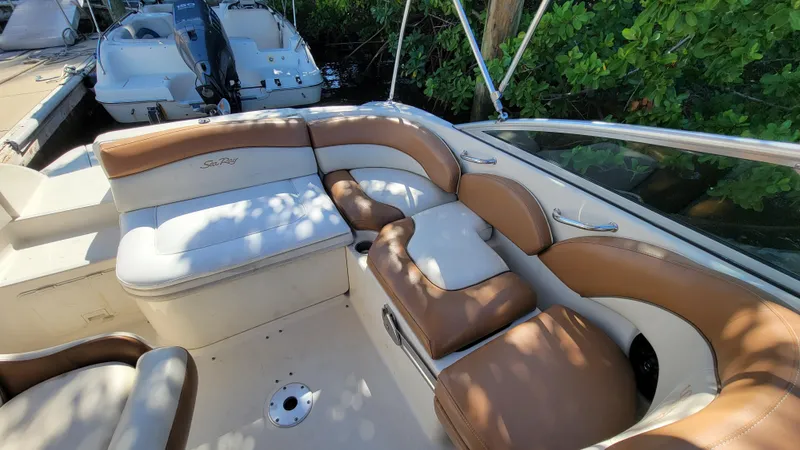 Slide: The Image of 2007 Sea Ray SunDeck 200 boat interior with tan leather seating. - 26