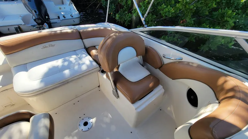 Slide: The Image of 2007 Sea Ray SunDeck 200 interior with tan and white seating. - 27