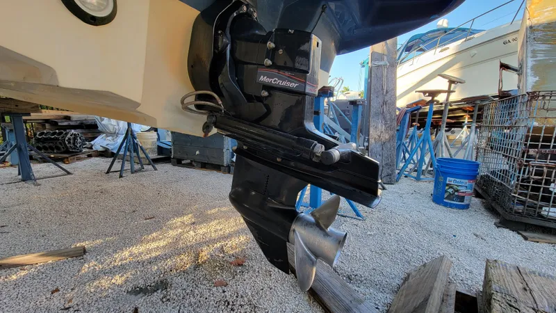 Slide: The Image of 2007 Sea Ray SunDeck 200 boat propeller and outdrive in a marina setting. - 36