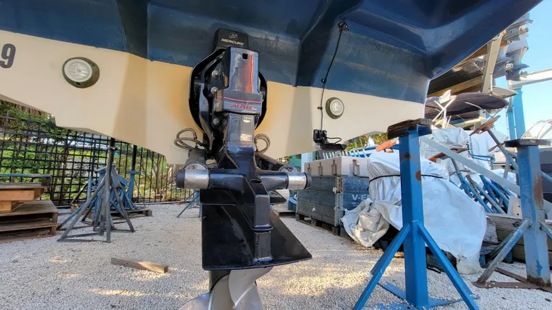 Slide: The Image of 2007 Sea Ray SunDeck 200 boat propeller and stern view in a boatyard. - 41