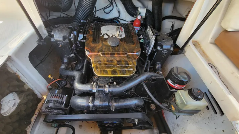 Slide: The Image of 2007 Sea Ray SunDeck 200 engine compartment with visible components and wiring. - 42