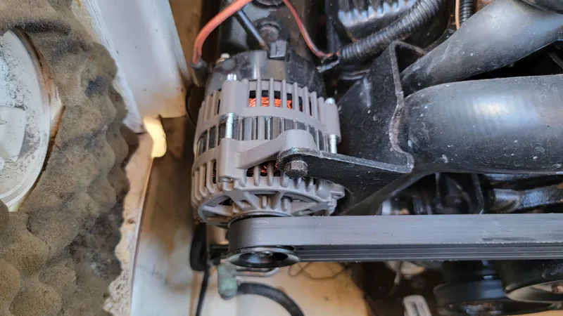 Slide: The Image of Close-up of a 2007 Sea Ray SunDeck 200 engine alternator. - 44