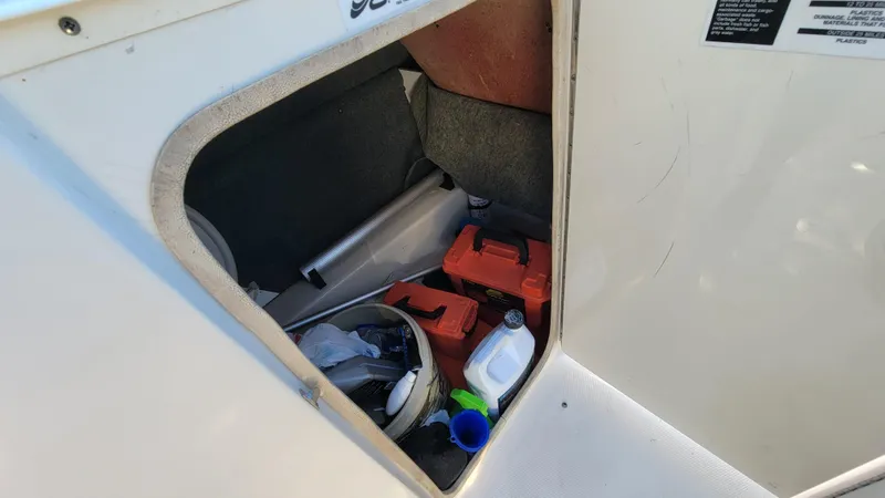 Slide: The Image of Storage compartment of 2007 Sea Ray SunDeck 200 with boating essentials. - 49