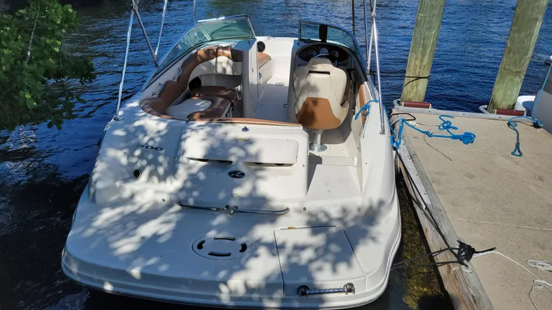 Slide: The Image of 2007 Sea Ray SunDeck 200 boat docked by the water, partially shaded. - 5
