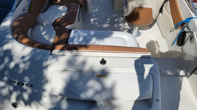 Slide: The Image of 2007 Sea Ray SunDeck 200 interior with tan seating and white deck. - 9