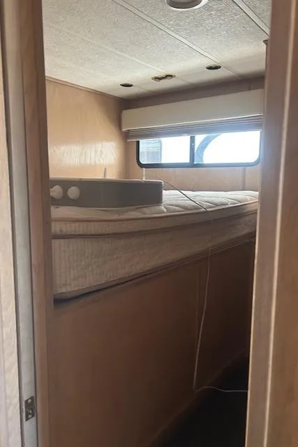 Slide: The Image of Interior of 2001 Stardust Cruisers Desert Oasis Week #30, featuring a compact bedroom space. - 13