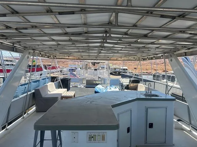 Slide: The Image of Upper deck of 2001 Stardust Cruisers Desert Oasis houseboat with seating and bar area. - 15