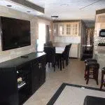 Slide: The Image of Interior of 2001 Stardust Cruisers Desert Oasis, featuring modern kitchen and dining area. - 3