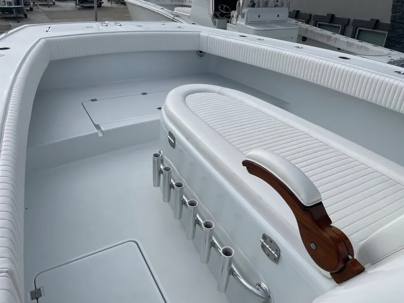 Slide: The Image of 2019 Freeman 37 boat interior with white seating and rod holders. - 14