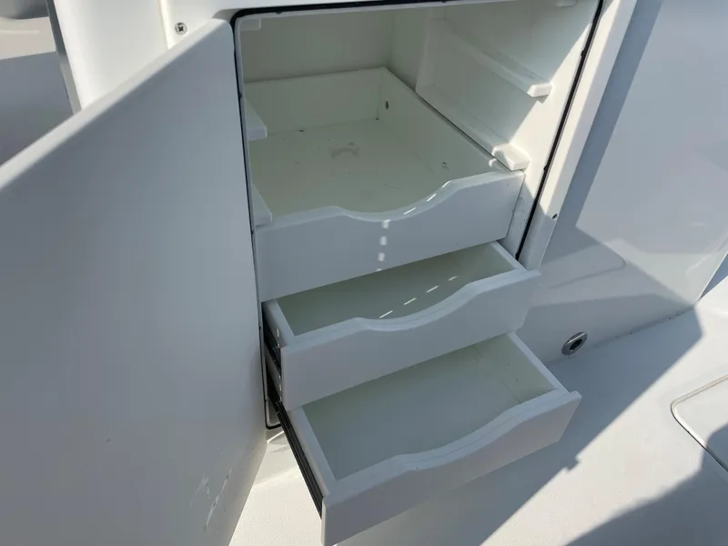 Slide: The Image of Open storage drawers on a 2019 Freeman 37 boat. - 19