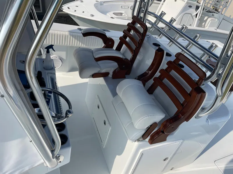Slide: The Image of 2019 Freeman 37 boat interior with cushioned seats and wooden accents. - 22