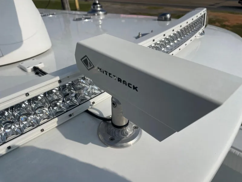 Slide: The Image of Radar equipment on a 2019 Freeman 37 boat with Mitey Rack branding. - 28