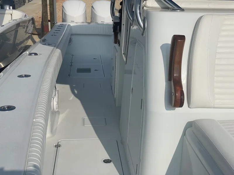 Slide: The Image of 2019 Freeman 37 boat interior with white seating and deck. - 29