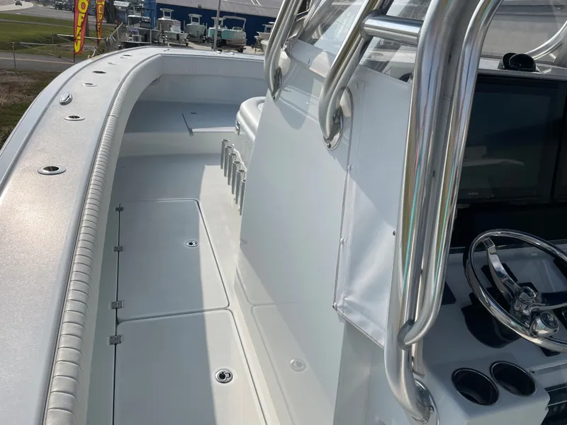 Slide: The Image of 2019 Freeman 37 boat deck with steering wheel and rod holders. - 31