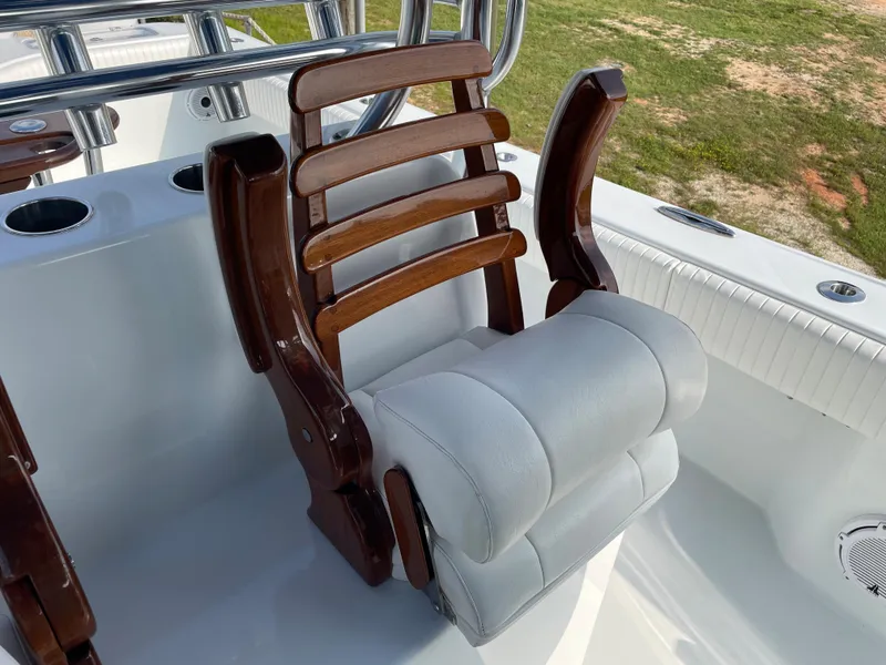Slide: The Image of Freeman 37 boat seat, 2019 model, with wooden armrests and cushioned backrest. - 42
