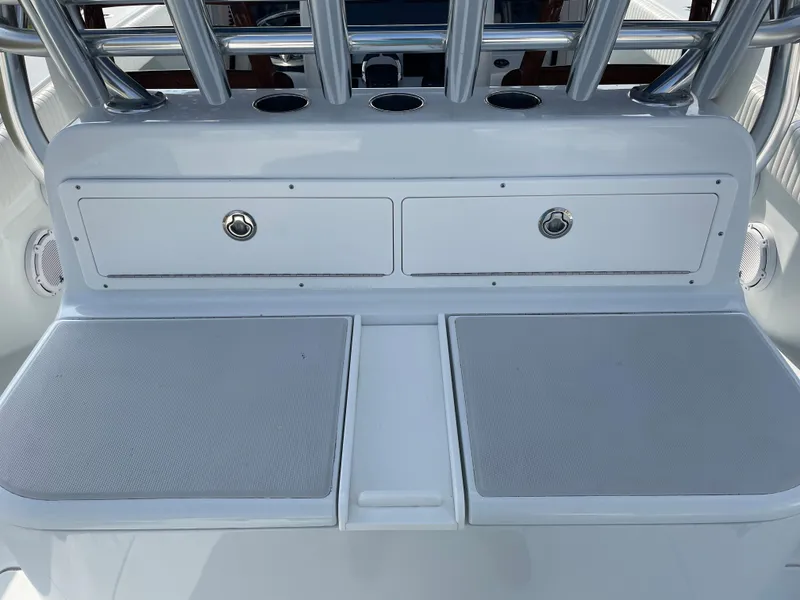 Slide: The Image of 2019 Freeman 37 boat console with storage compartments and rod holders. - 46