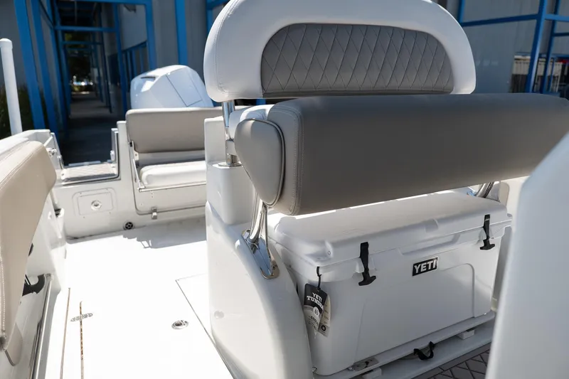 Slide: The Image of 2023 Finseeker 230 CC boat interior with Yeti cooler and cushioned seating. - 3