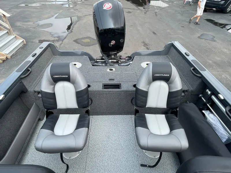 Slide: The Image of 2023 Crestliner 1850 Super Hawk boat interior with two seats and outboard motor. - 3
