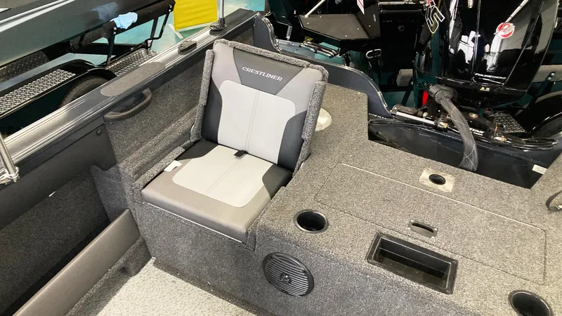 Slide: The Image of 2023 Crestliner 1850 Super Hawk boat interior with seating and storage compartments. - 7