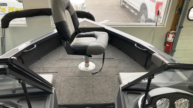 Slide: The Image of 2023 Crestliner 1850 Super Hawk interior with swivel seat and carpeted deck. - 8