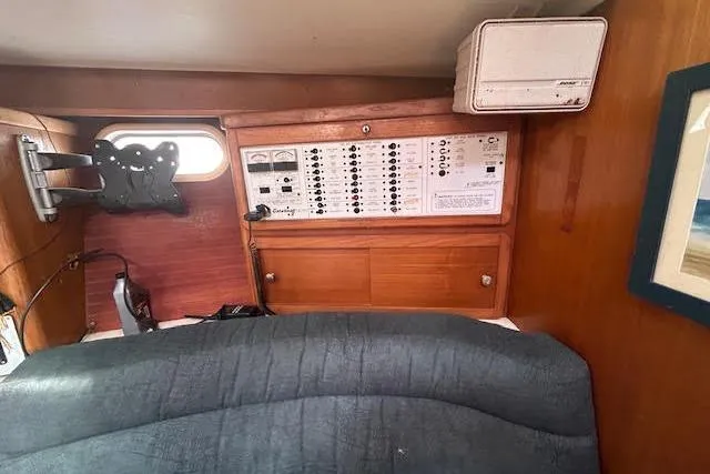 Slide: The Image of Interior of 2000 Catalina 42 Mk II sailboat with control panel and window. - 11