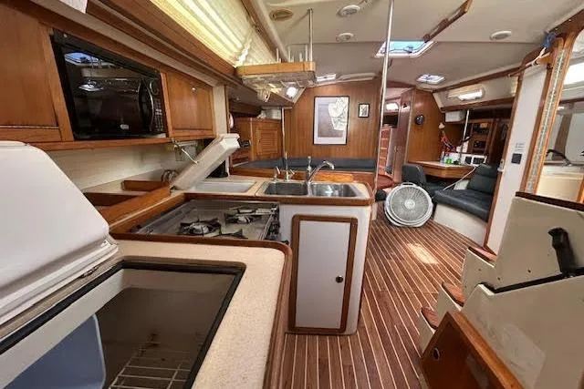 Slide: The Image of Interior of a 2000 Catalina 42 Mk II sailboat with wood finish and modern amenities. - 14