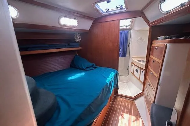 Slide: The Image of Cozy cabin interior of 2000 Catalina 42 Mk II sailboat with bed and bathroom. - 16
